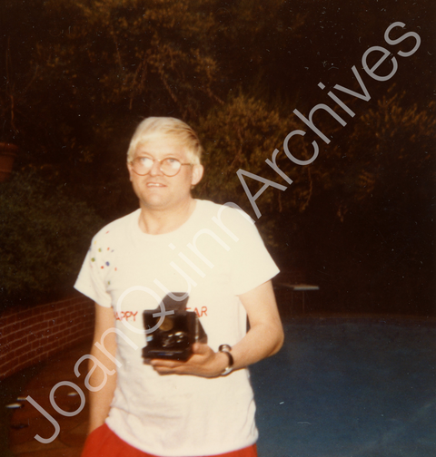 David Hockney Holding a Polaroid Camera by the Pool at the Hockney Home